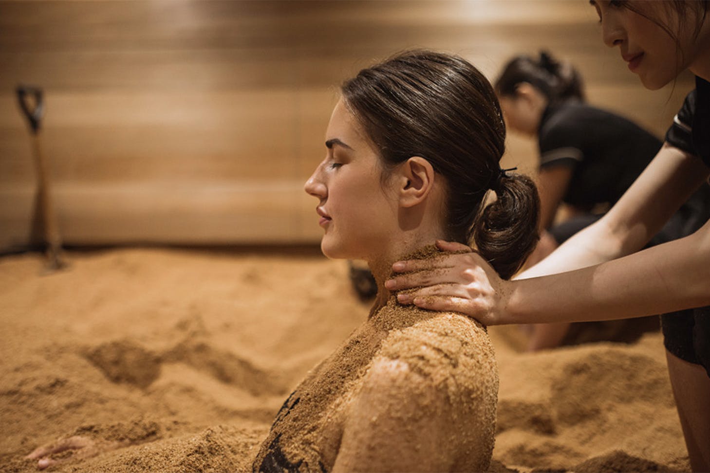 A woman enjoys an enzyme treatment at Ikoi Spa